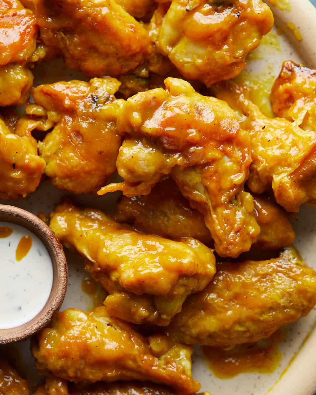 Up close image of mango habanero wings. 