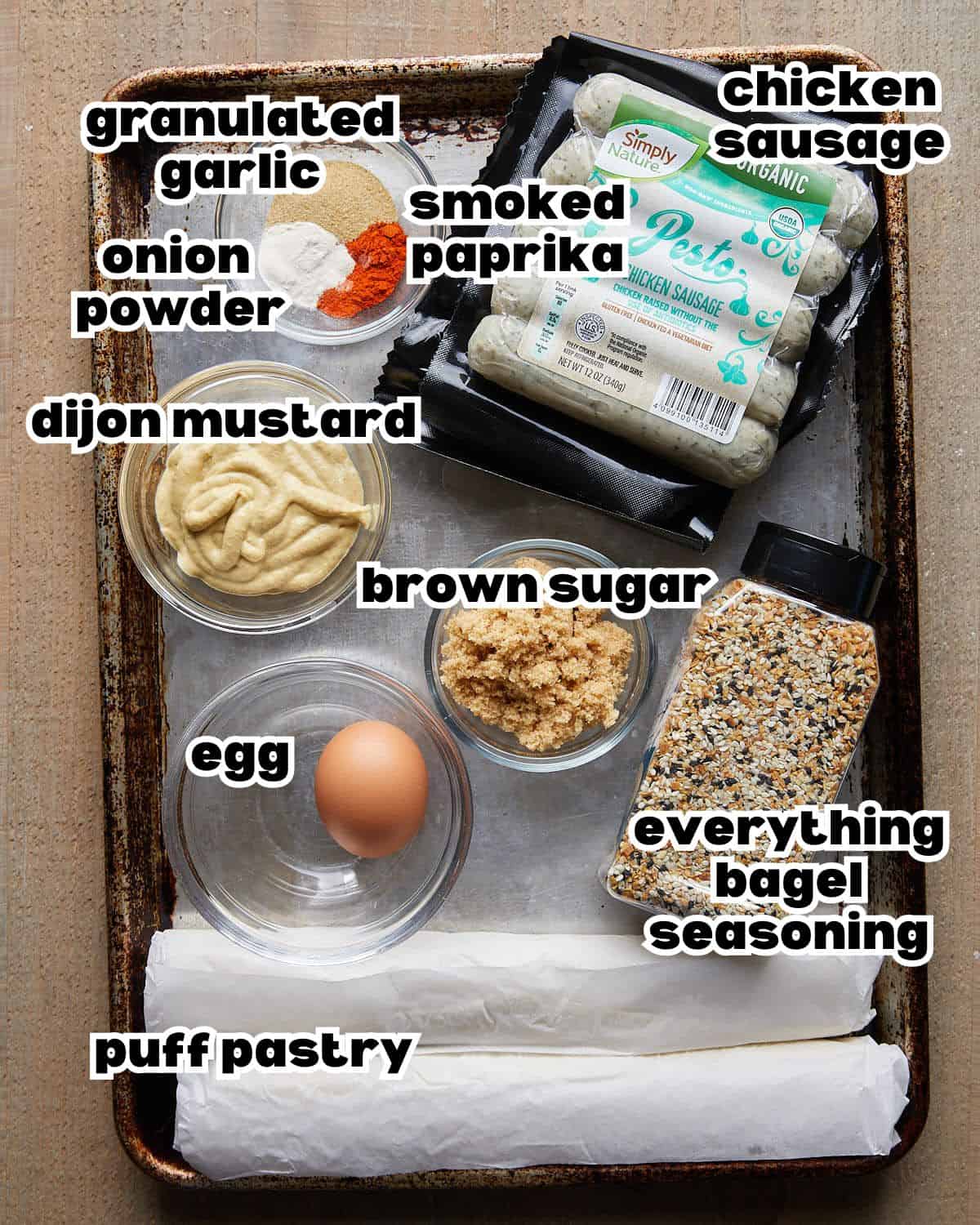 Overhead image of ingredients to make chicken sausage rolls with puff pastry. 
