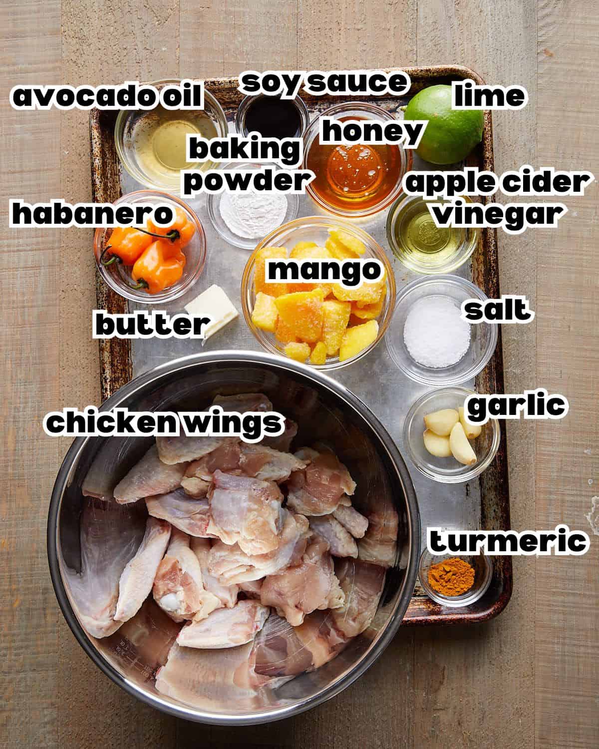 Overhead image of ingredients needed to make mango habanero wings. 
