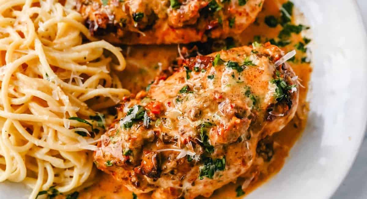 Overhead image of marry me chicken recipe with pasta on the side. 