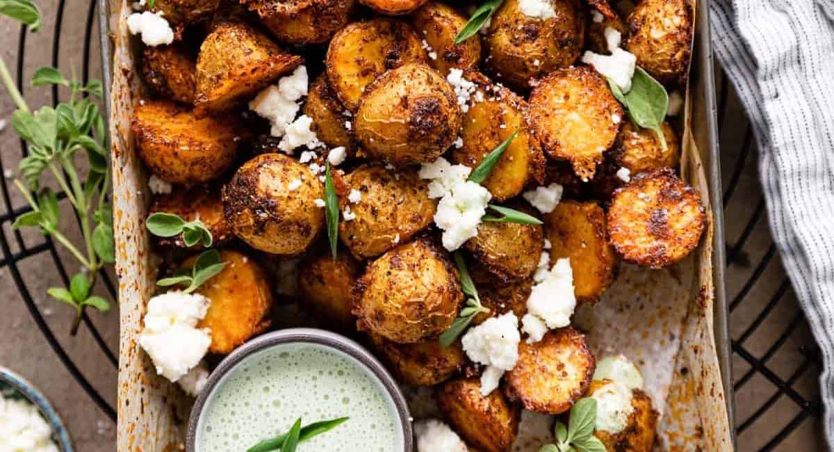 Overhead image of Mexican potatoes with garnish. 