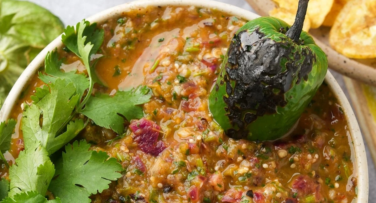 Overhead image of salsa verde with garnish. 