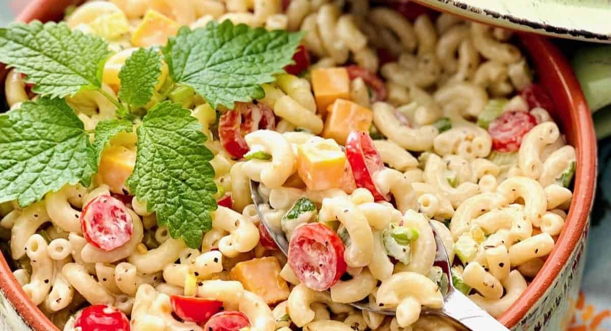Overhead image of southern macaroni salad recipe with garnish. 