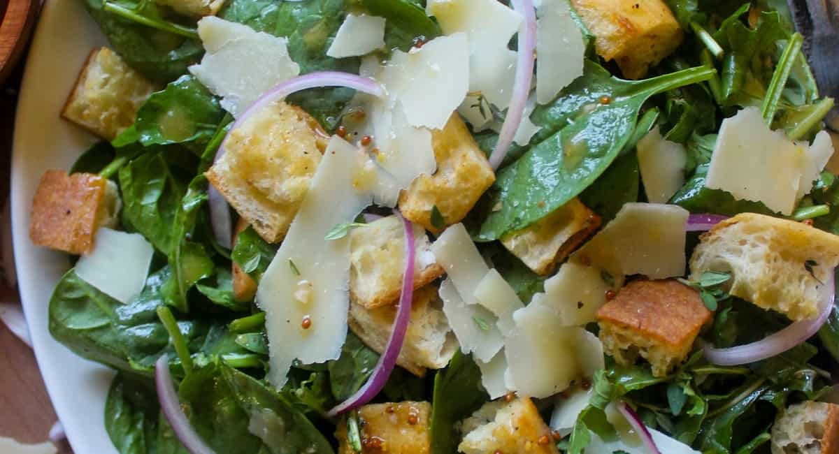 Overhead up close image of spinach arugula salad. 