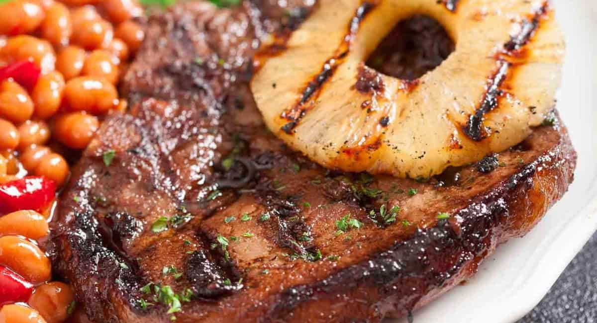Up close image of grilled pork chops with marinade. 