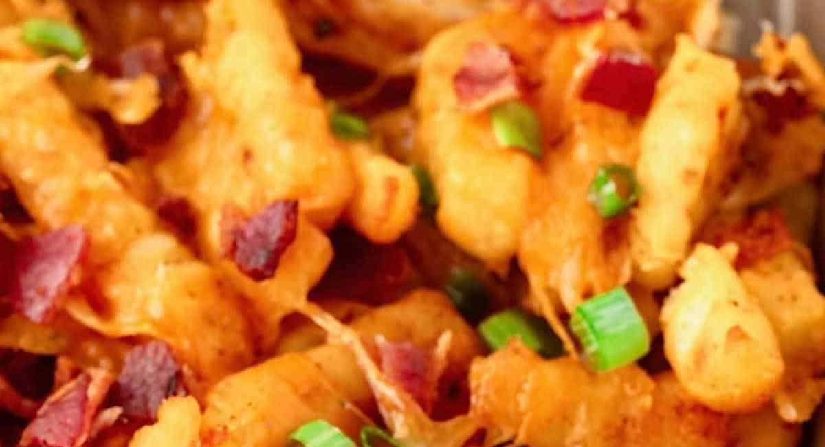 Overhead image of loaded french fries with garnish. 
