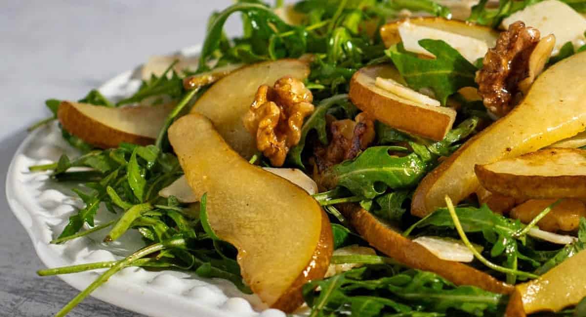 Up close image of caramelized pear and rocket salad. 