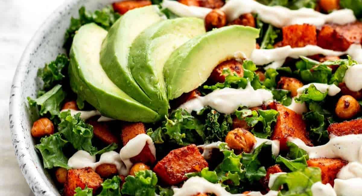 Overhead image of roasted sweet potato & chickpea kale salad bowl. 