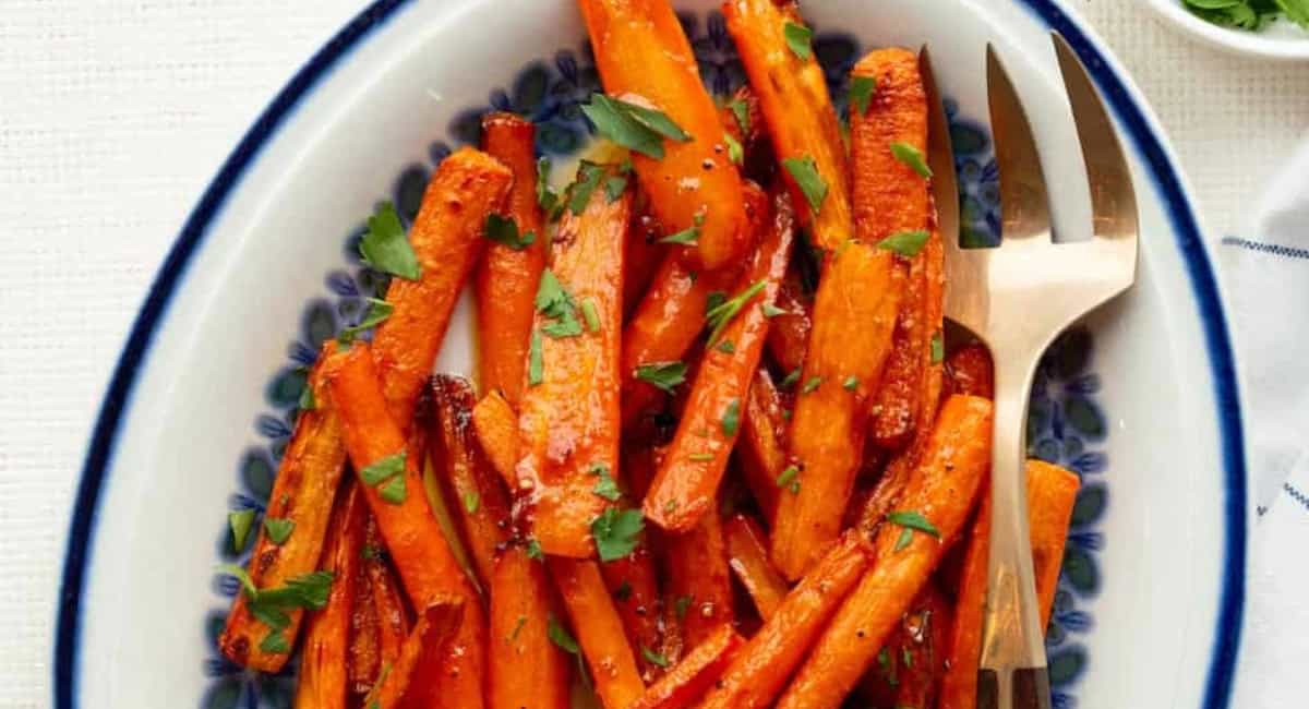 Overhead image of hot honey roasted carrots in the air fryer. 