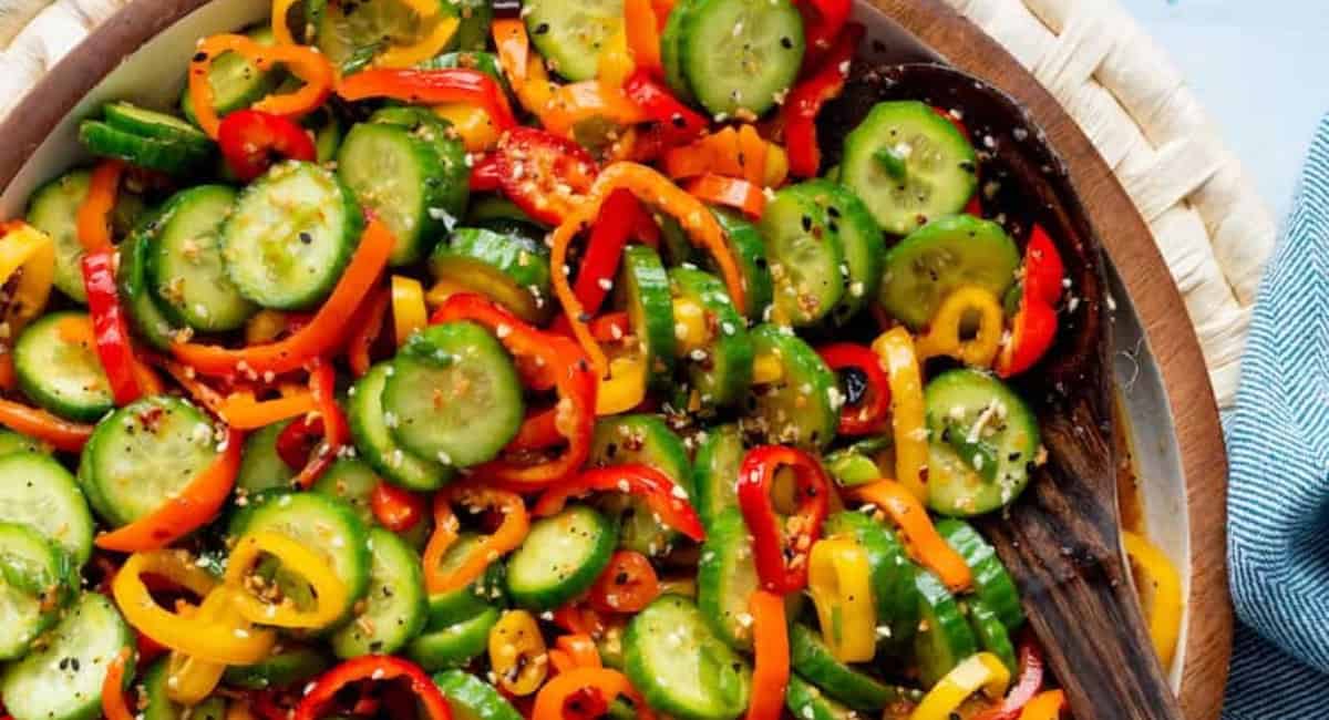 Overhead image of sweet pepper and cucumber salad with ginger dressing. 
