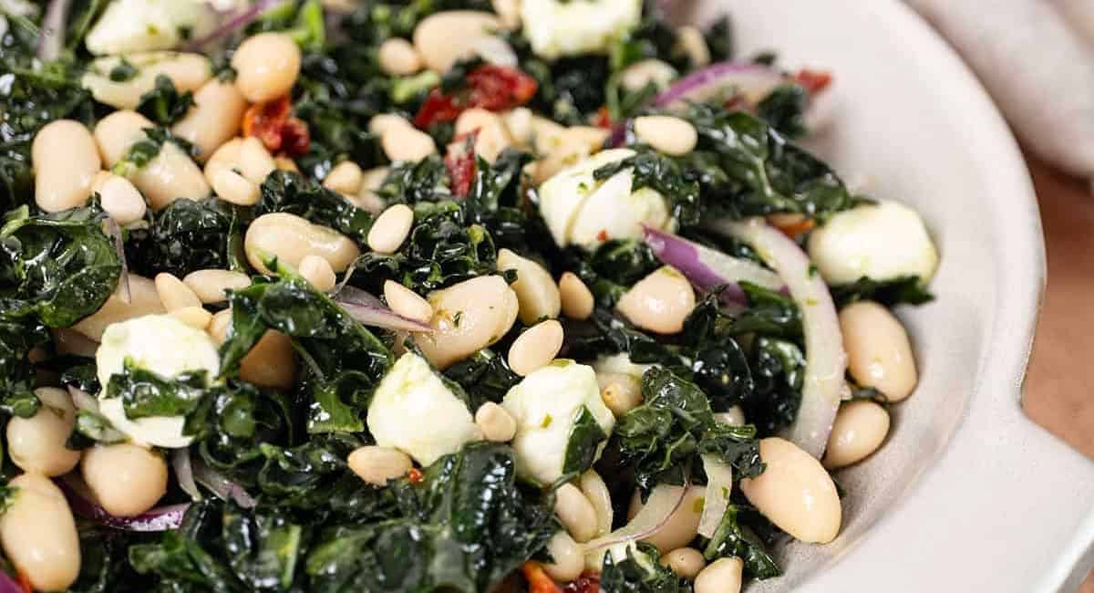 Overhead image of kale and cannellini bean salad. 