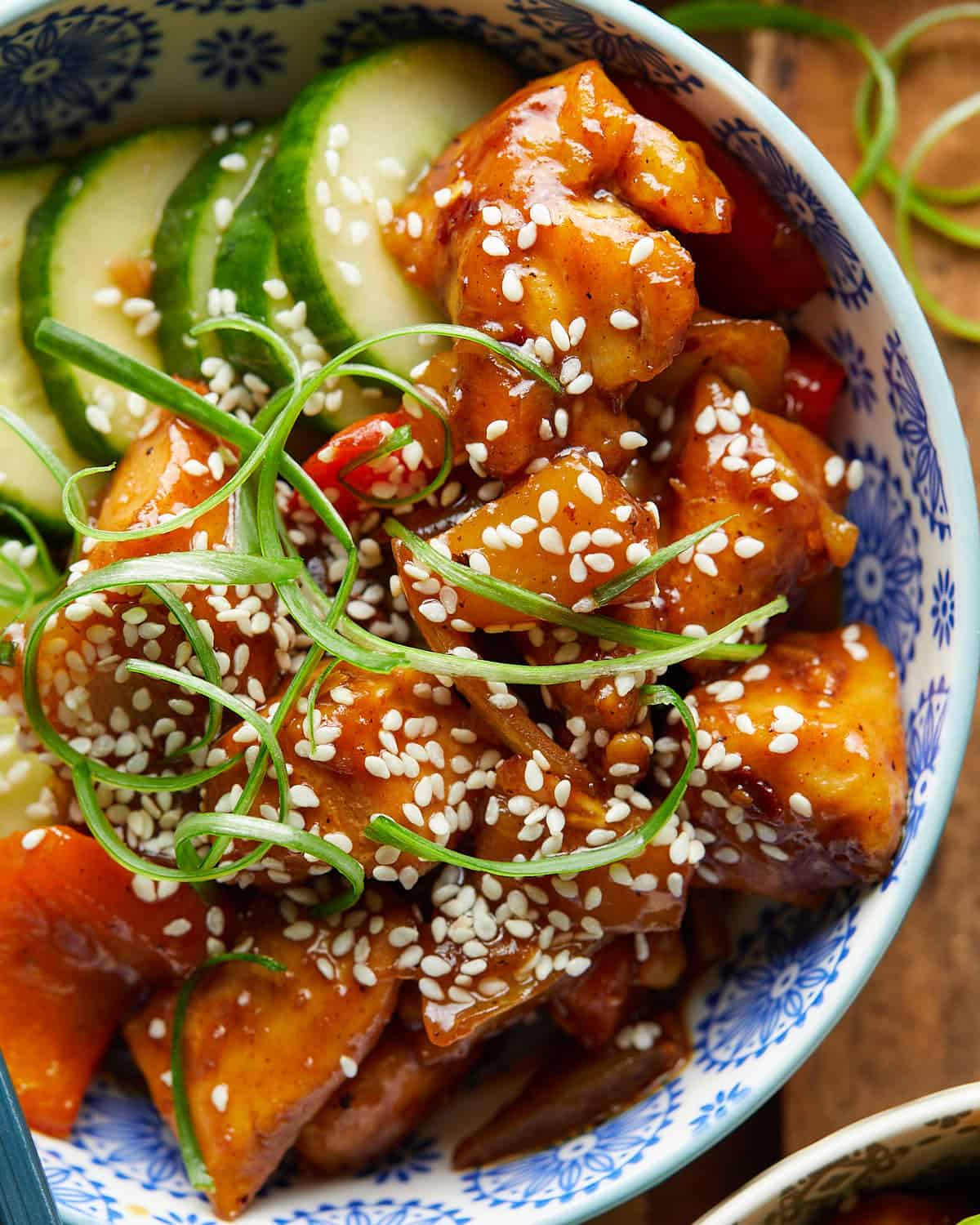 Overhead image of pineapple teriyaki chicken with garnish. 