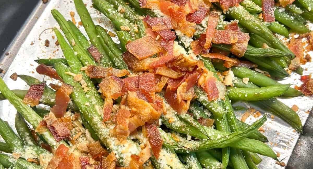 Overhead image of parmesan roasted green beans with bacon. 