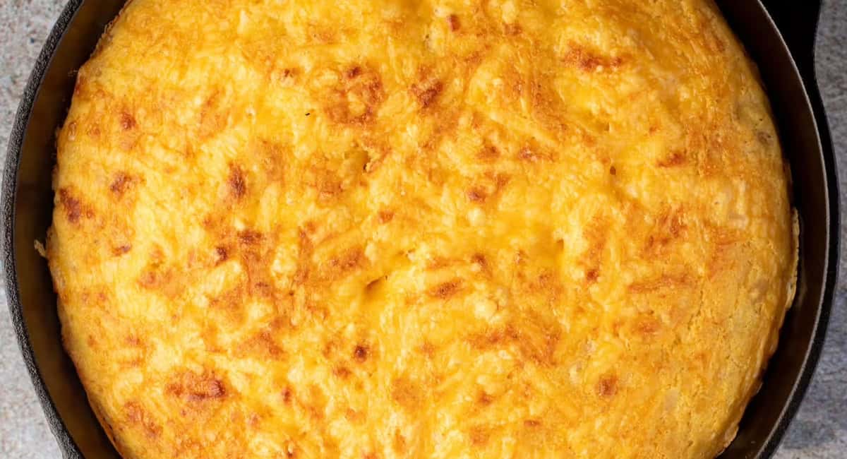 Overhead image of cast iron skillet jalapeno cheddar cornbread. 