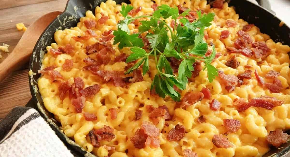 Overhead image of smoked mac and cheese with garnish. 