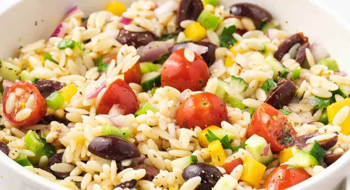Up close image of orzo pasta salad with honey dijon dressing. 