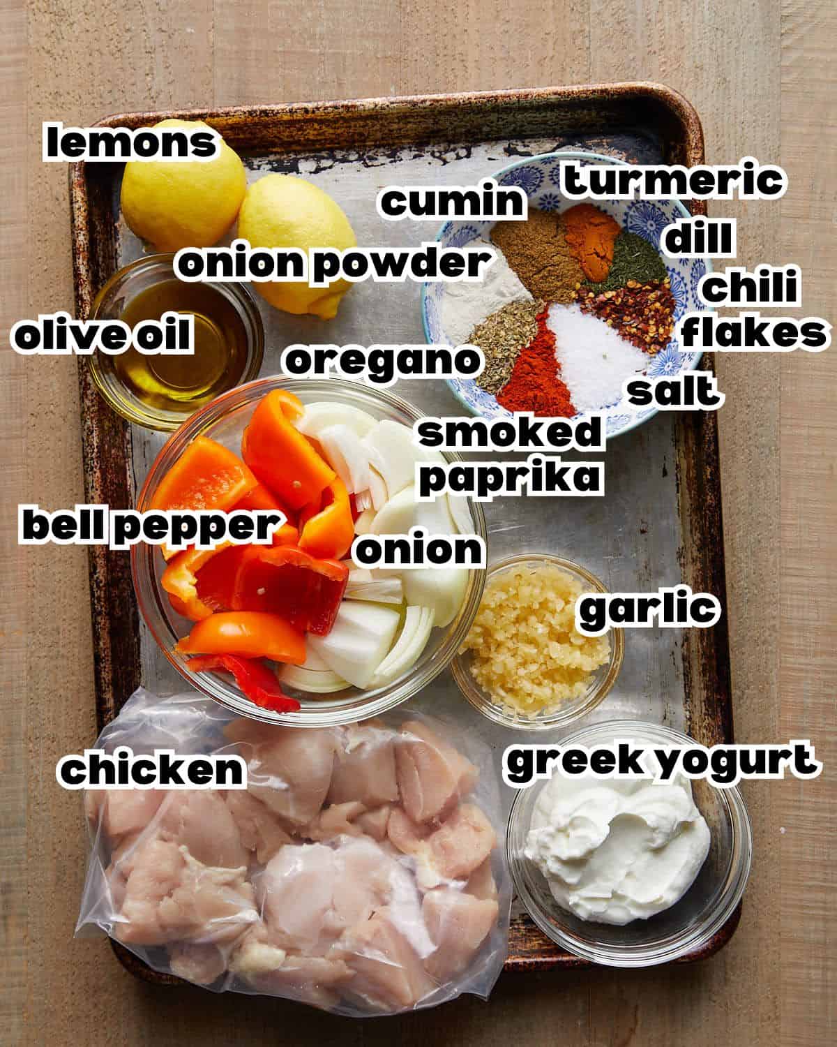 Overhead image of ingredients needed to make chicken kabobs in the oven. 