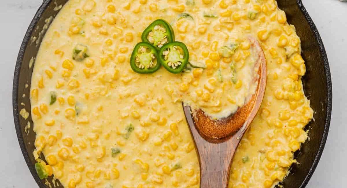 Overhead image of spicy jalapeno creamed corn with jalapeno garnish. 