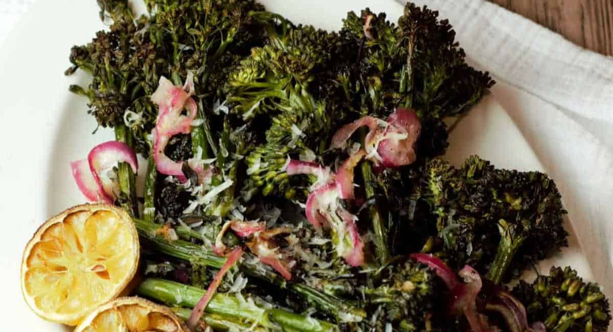 Overhead image of charred broccolini roasted with lemon, Parmesan, and garlic. 