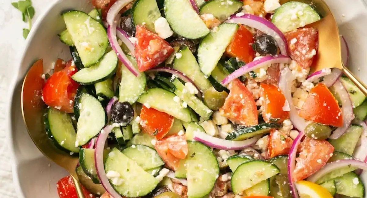 Overhead image of Greek cucumber salad with garnish. 