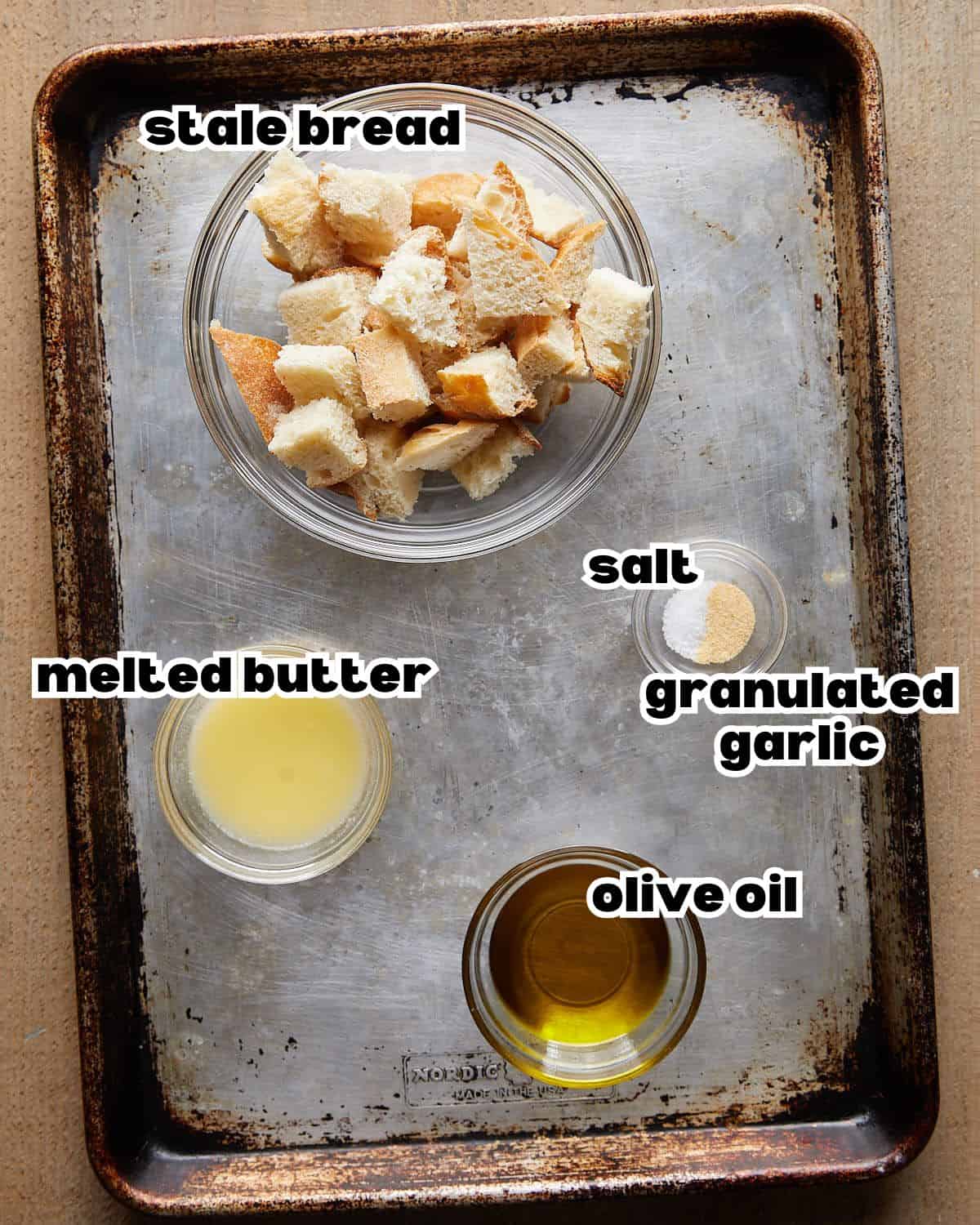 Overhead image of ingredients needed to make air fryer croutons. 