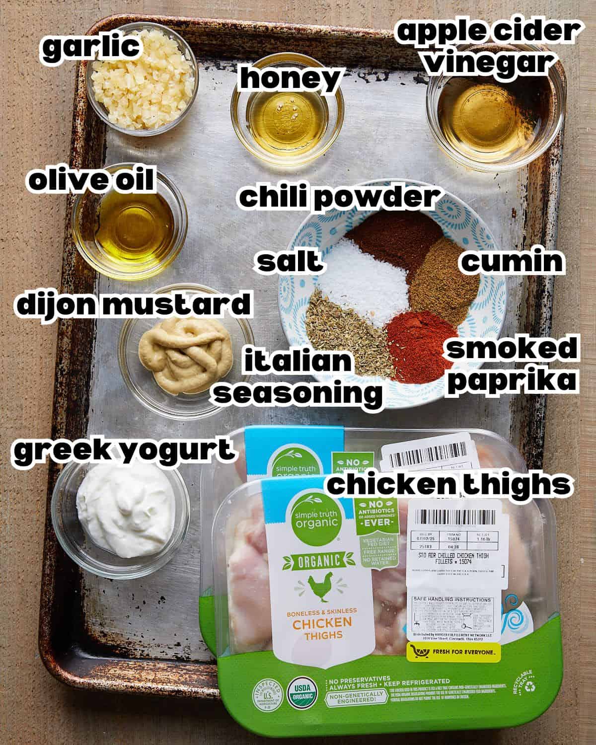 Overhead image of ingredients needed to make grilled boneless chicken thighs. 