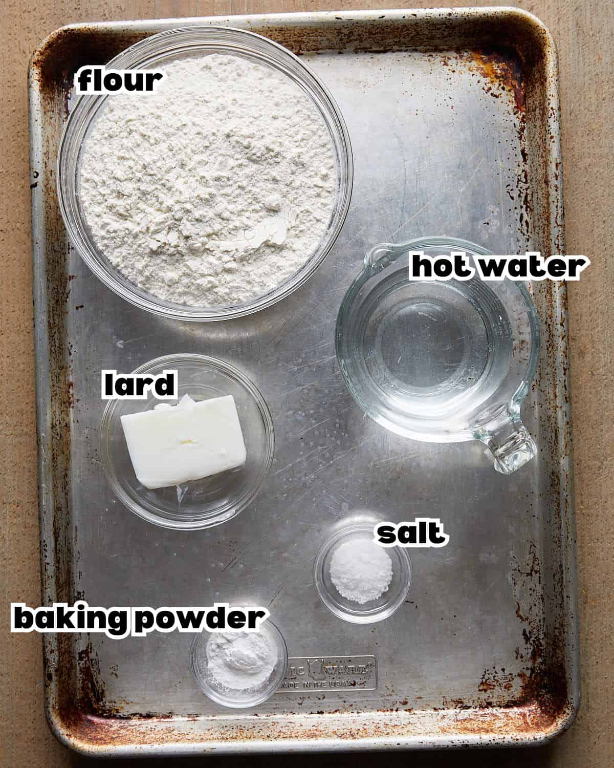Overhead image of ingredients needed to make homemade flour tortillas. 