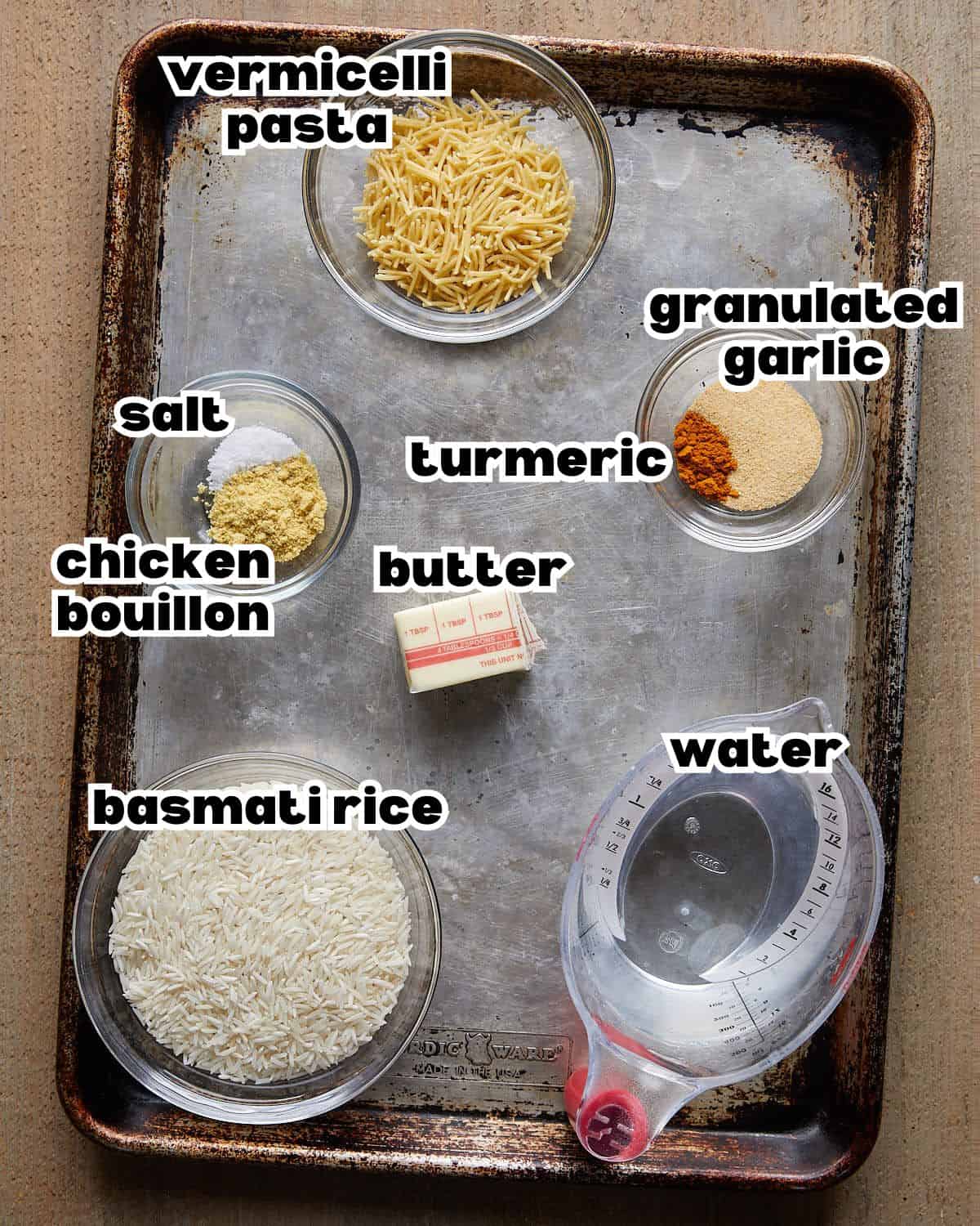 Overhead image of ingredients needed to make yellow rice recipe. 