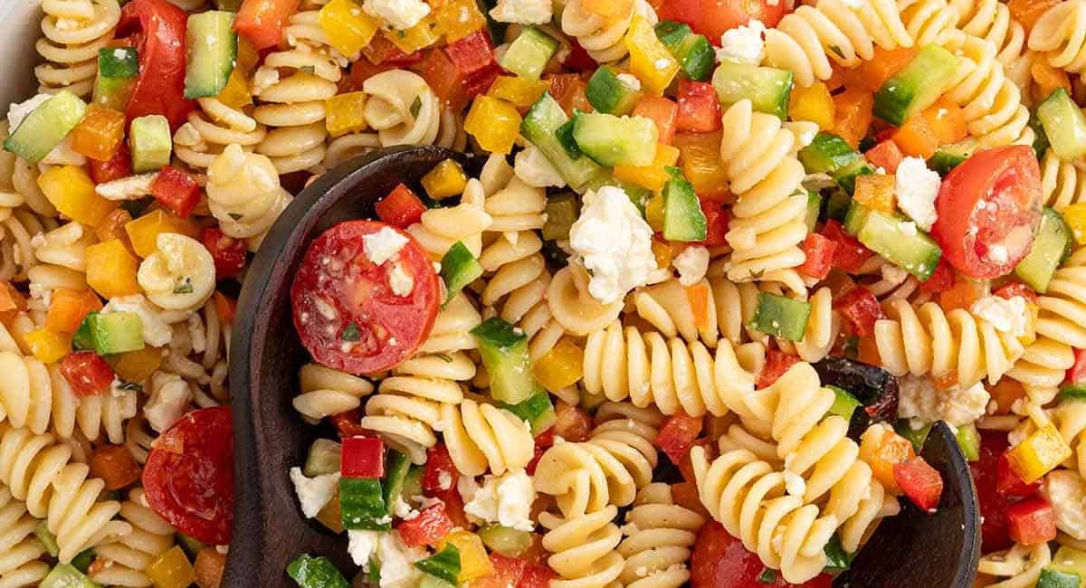Overhead up close image of summer pasta salad. 