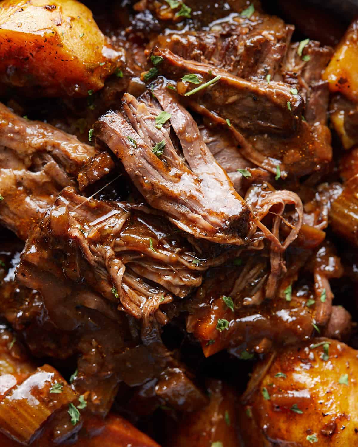 Close-up overhead view of shredded beef from Dutch Oven Pot Roast.