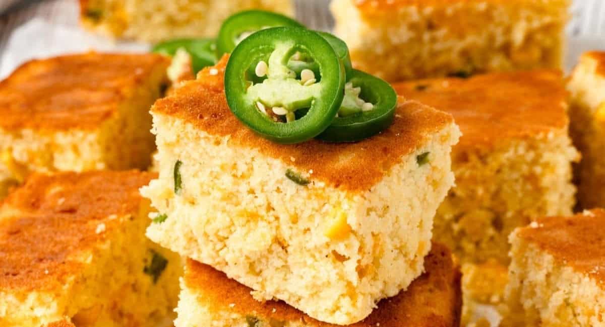 Up close image of jalapeno cornbread with jalapeno garnish. 