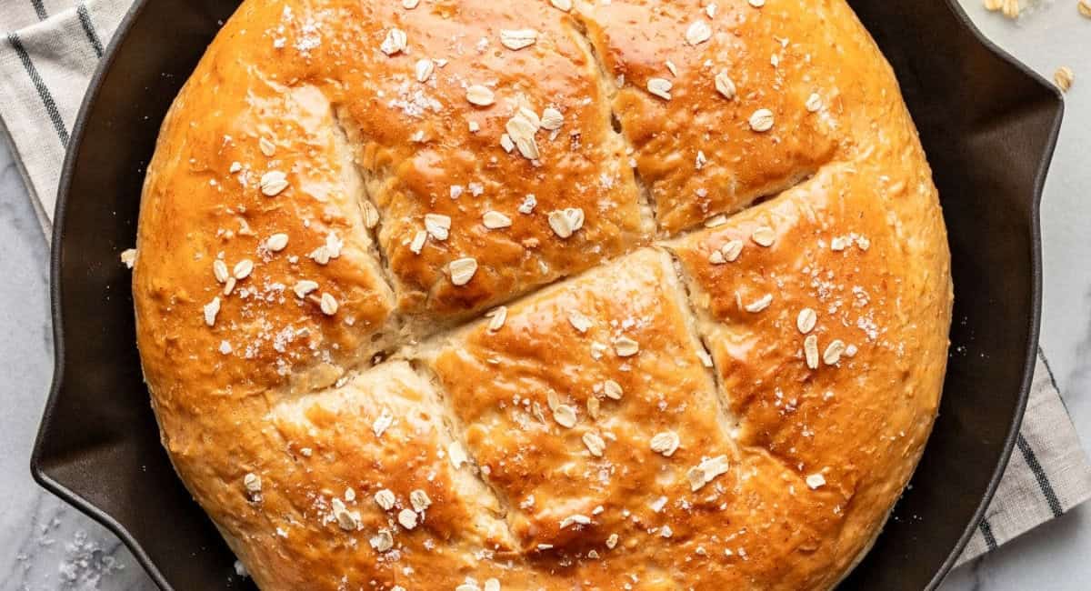 Overhead image of honey oat skillet bread in skillet. 