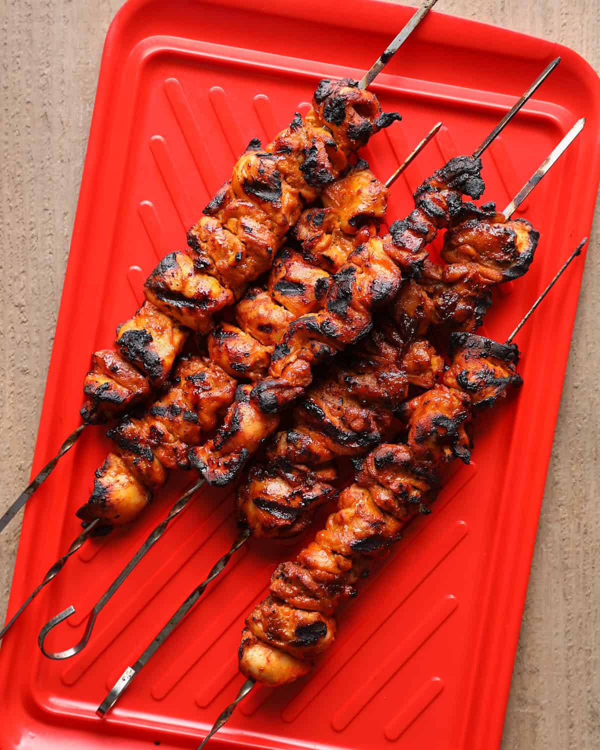 Chicken skewers grilled until browned, lightly charred, and glazed with chipotle hot honey.