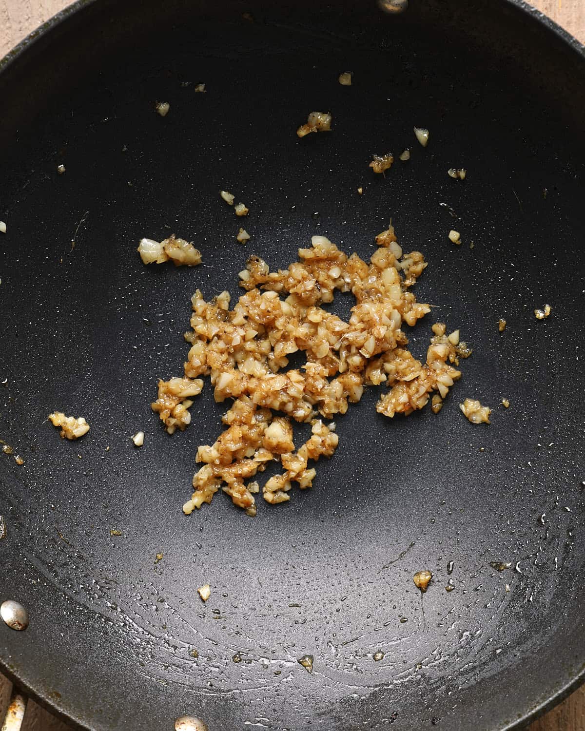 Garlic and ginger cooking in a skillet for Mongolian beef.