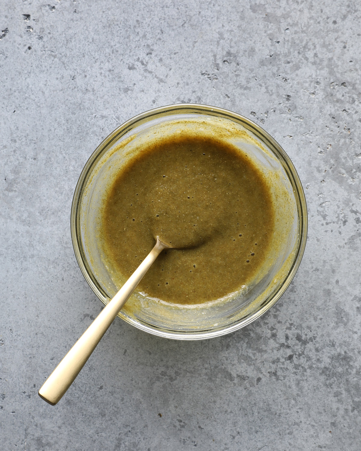 Maple Dijon seasoning mixture stirred together in a glass bowl.
